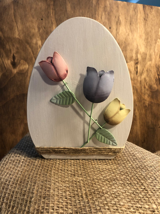 Egg sign with metal flowers